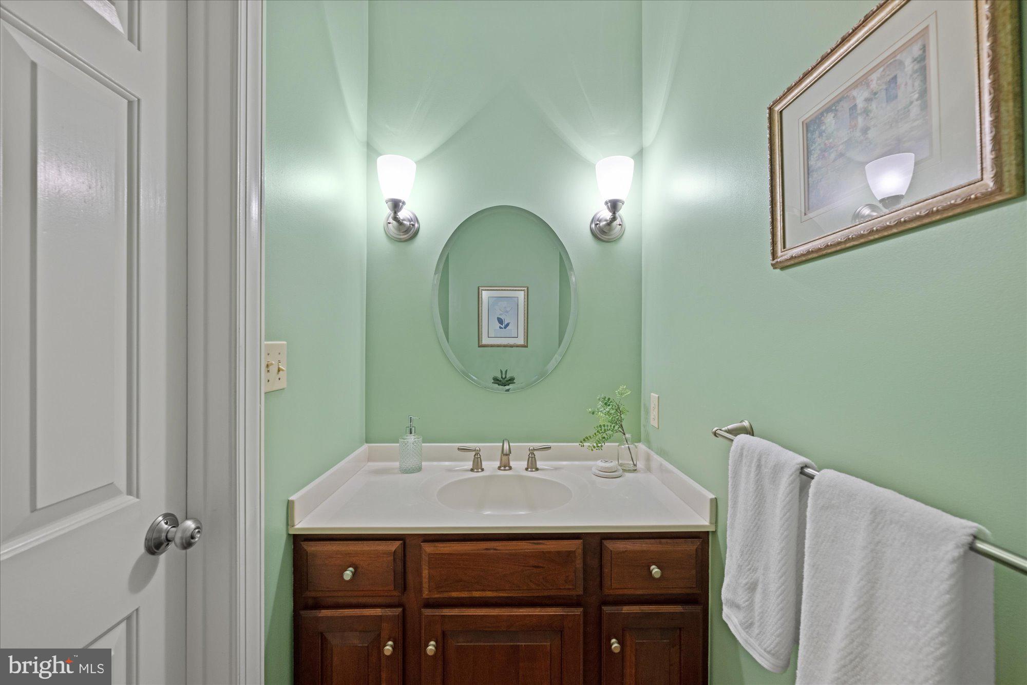 7822 Hidden Meadow Terrace Potomac, MD 20854 - Photo 16 of 29 a bathroom with a sink and a mirror