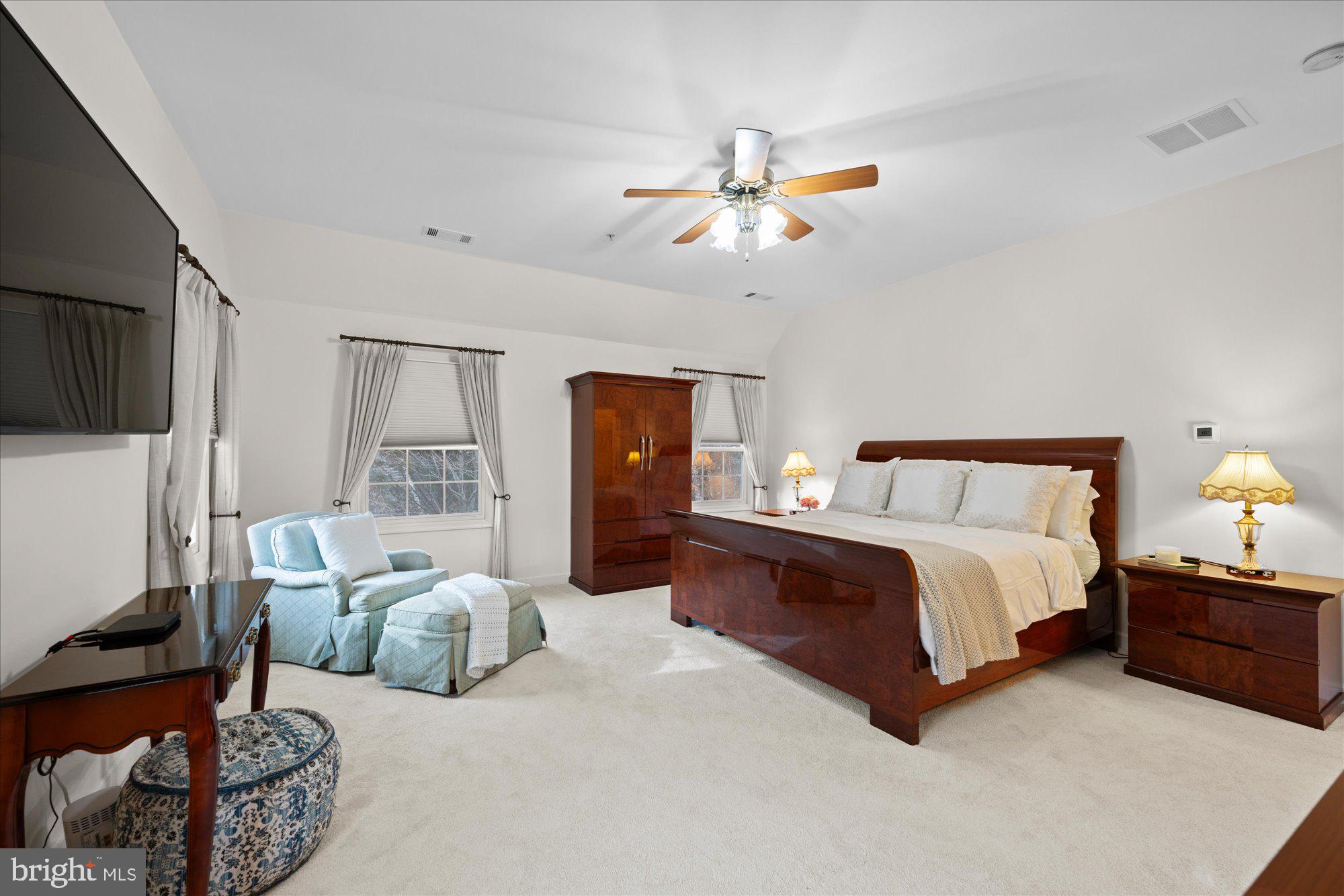 7822 Hidden Meadow Terrace Potomac, MD 20854 - Photo 18 of 29 a spacious bedroom with a bed couch and a window