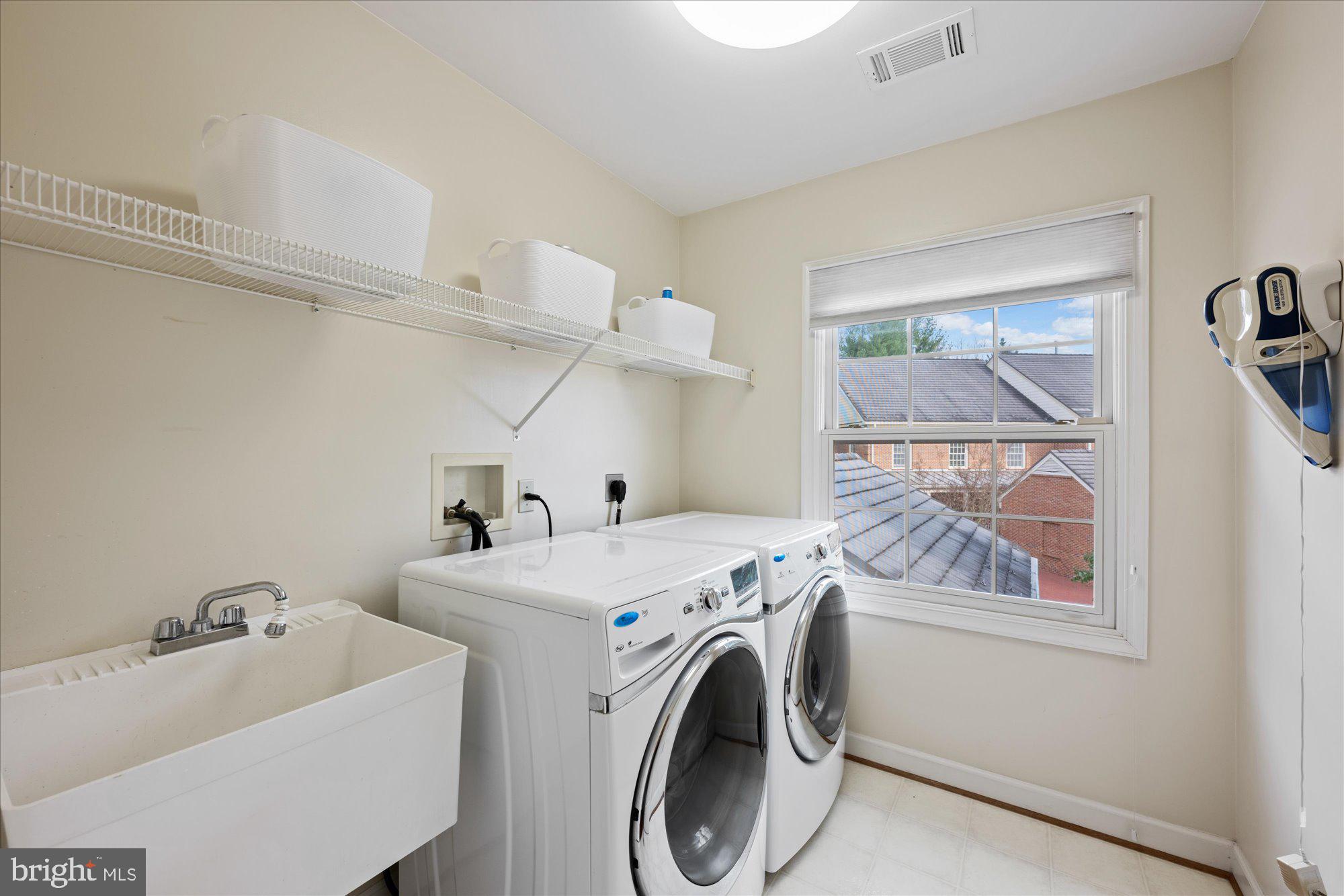 7822 Hidden Meadow Terrace Potomac, MD 20854 - Photo 23 of 29 a utility room with dryer and washer