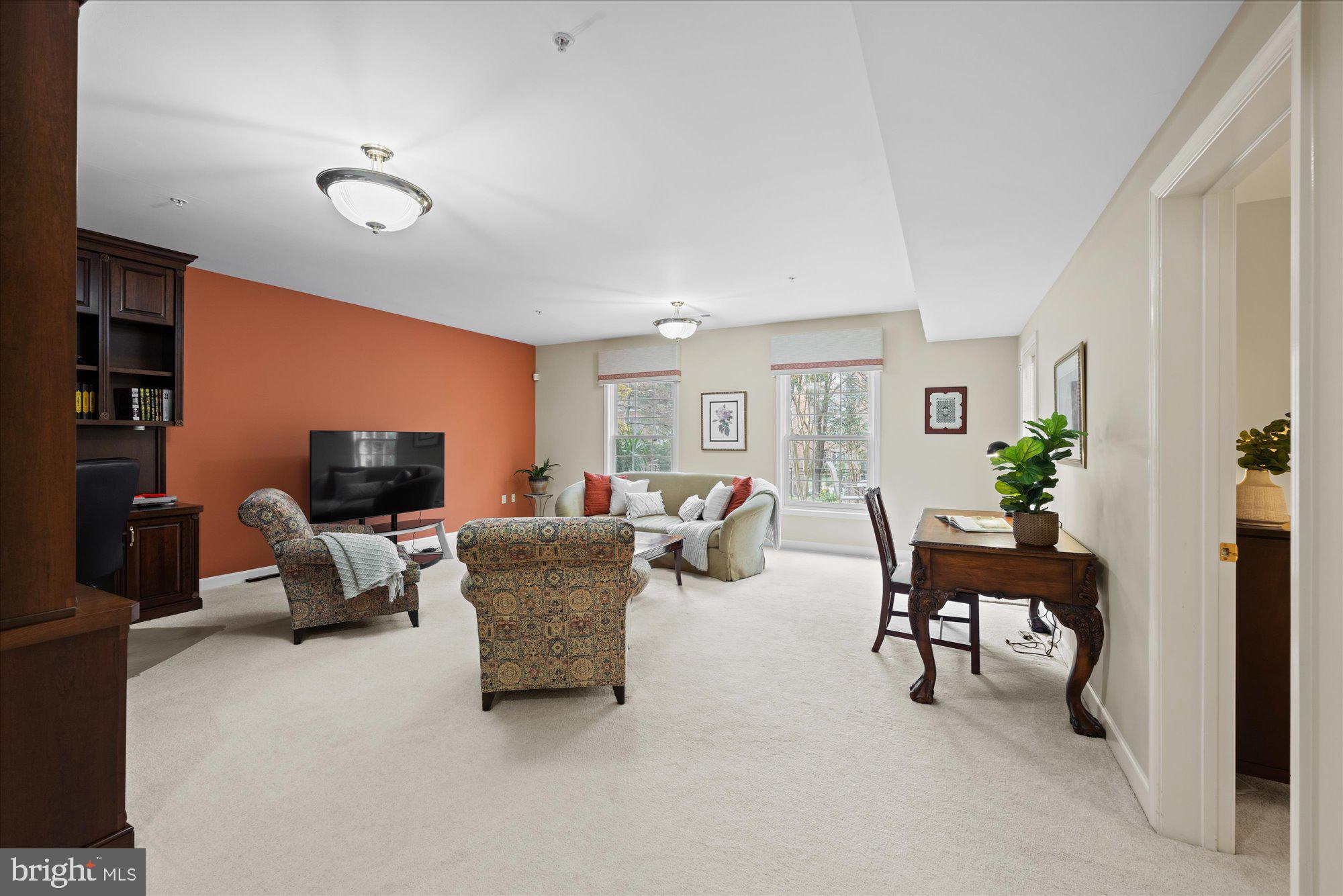 7822 Hidden Meadow Terrace Potomac, MD 20854 - Photo 24 of 29 a living room with furniture and a flat screen tv