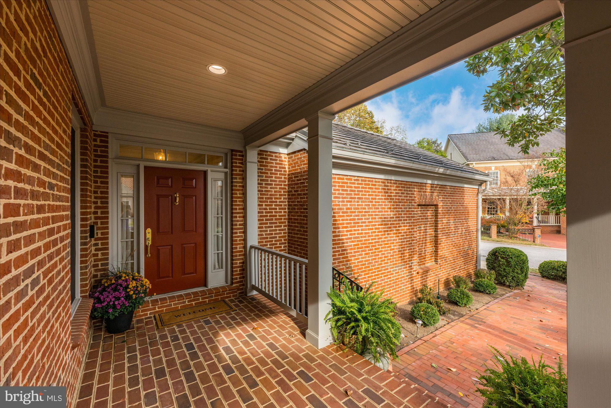 7822 Hidden Meadow Terrace Potomac, MD 20854 - Photo 3 of 29 a view of porch with a table and chairs and potted plants