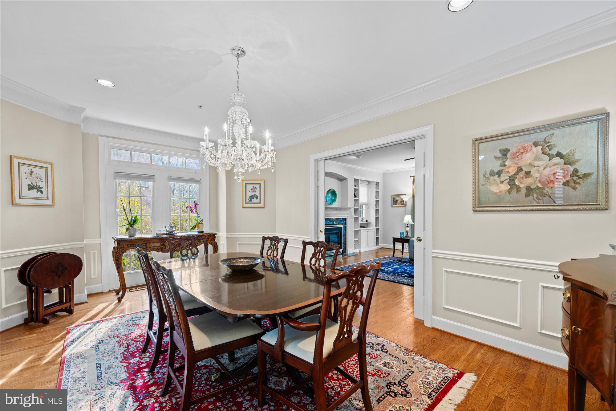 7822 Hidden Meadow Terrace Potomac, MD 20854 - Photo 7 of 29 a view of a dining room with furniture and chandelier