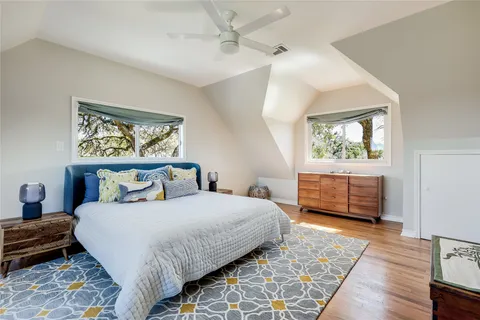 a bathroom with a tub a sink and a large mirror