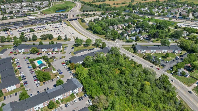 an aerial view of residential houses with outdoor space