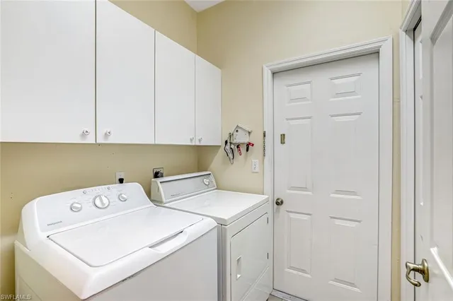 a view of storage and utility room with washer and dryer