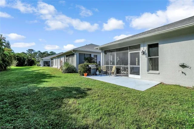a view of a house with backyard porch and garden