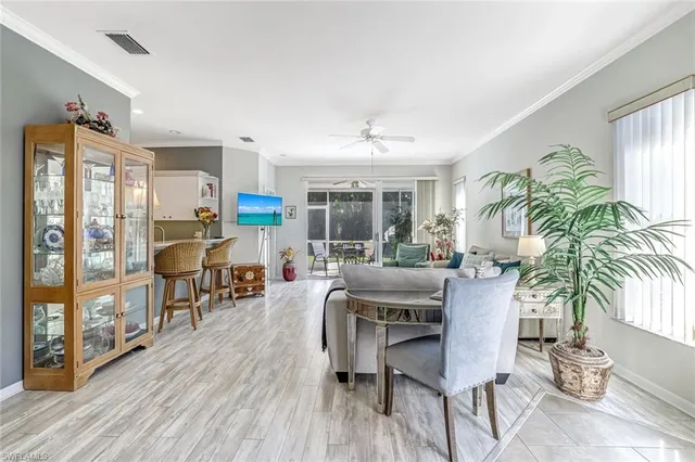 a dining room with furniture and wooden floor