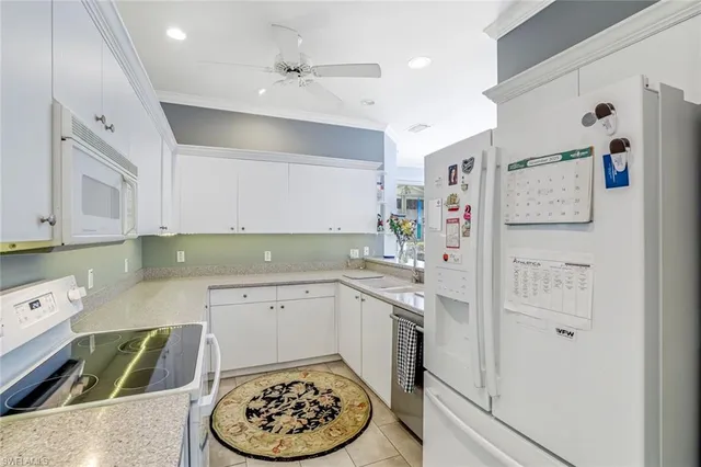 a kitchen with a sink and refrigerator