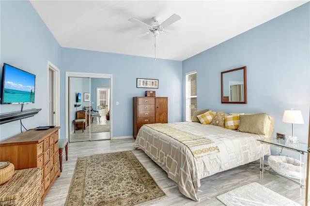 a bedroom with a large bed and a couch