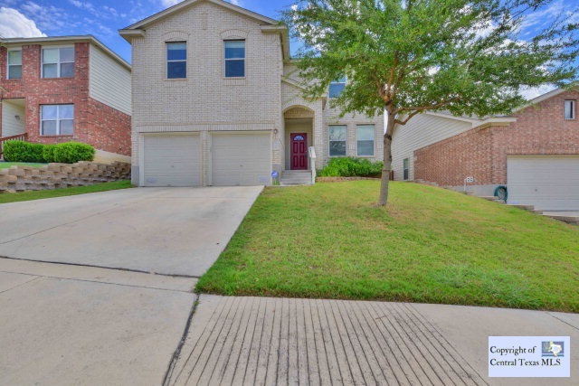 9718 Bowsprit Pier Converse, TX 78109 - Photo 1 of 1 a front view of a house with a yard and garage