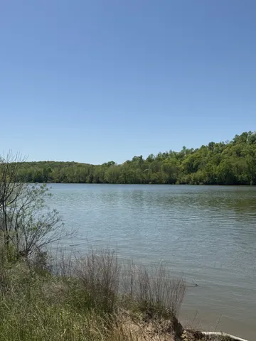 a view of lake with mountain in background