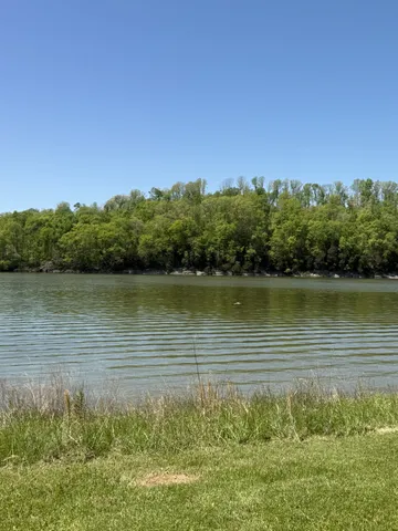 a view of an ocean with a mountain in the background
