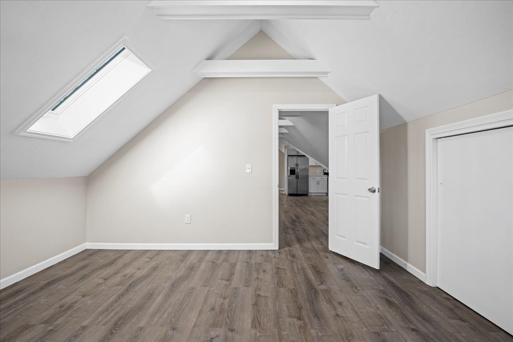 15 Clearview Avenue, Unit 3 Worcester, MA 01605 - Photo 11 of 24 a view of a hallway to an empty room with wooden floor and closet