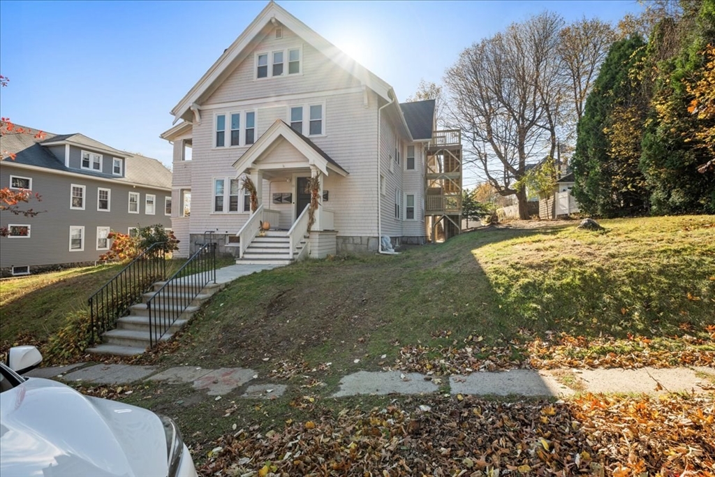 15 Clearview Avenue, Unit 3 Worcester, MA 01605 - Photo 21 of 24 a front view of a house with a yard
