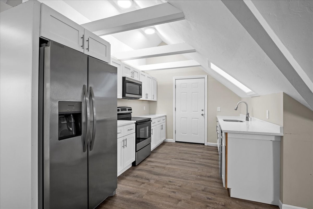 15 Clearview Avenue, Unit 3 Worcester, MA 01605 - Photo 3 of 24 a kitchen with a refrigerator a sink and dishwasher