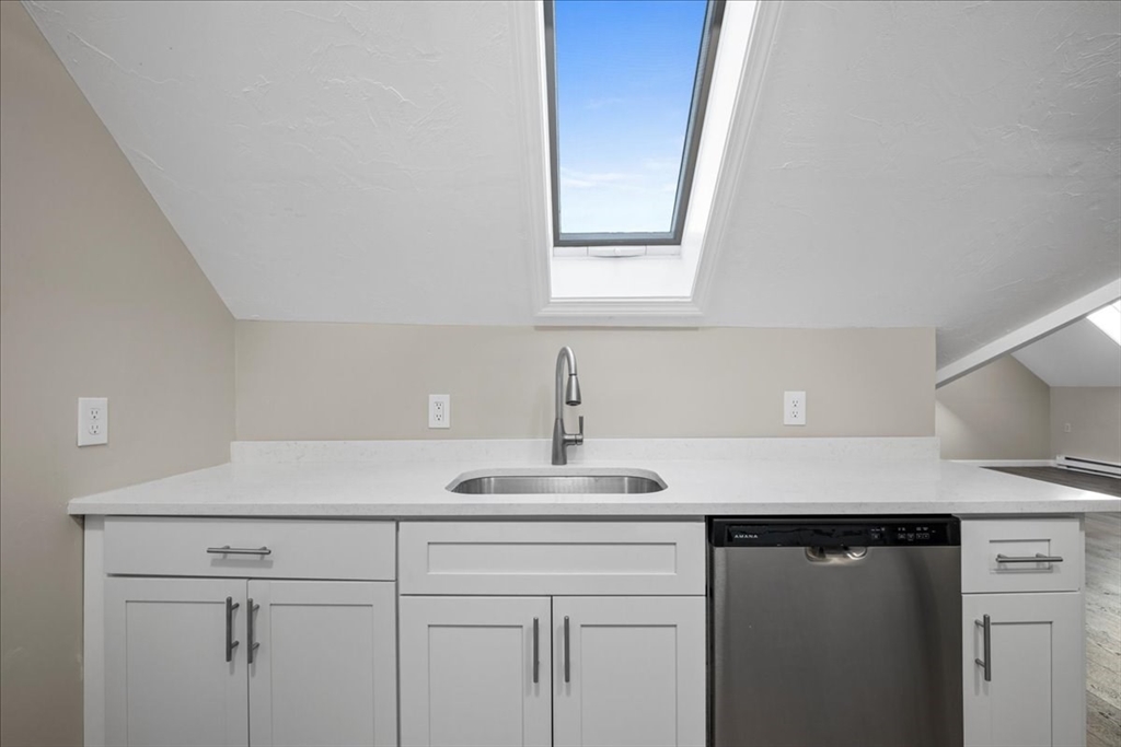 15 Clearview Avenue, Unit 3 Worcester, MA 01605 - Photo 5 of 24 a kitchen with a sink and cabinets