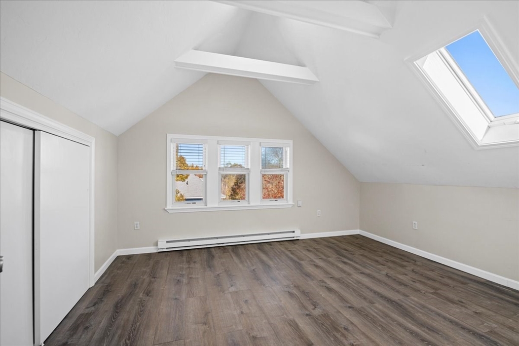 15 Clearview Avenue, Unit 3 Worcester, MA 01605 - Photo 10 of 24 an empty room with wooden floor and windows