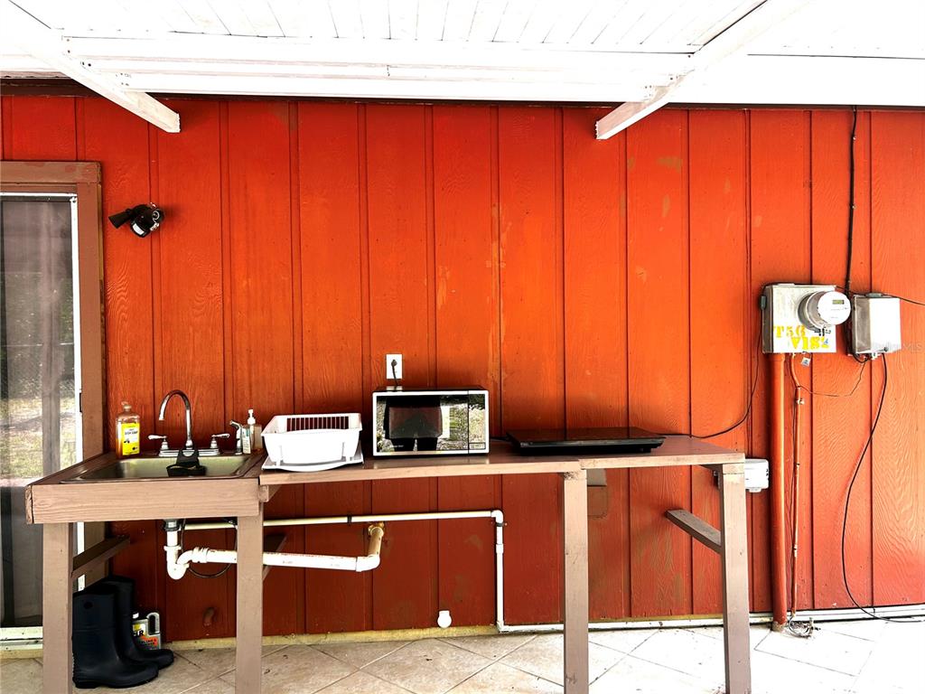 14545 Southwest 34th Terrace Road Ocala, FL 34473 - Photo 27 of 33 Back porch sink for a kitchen!