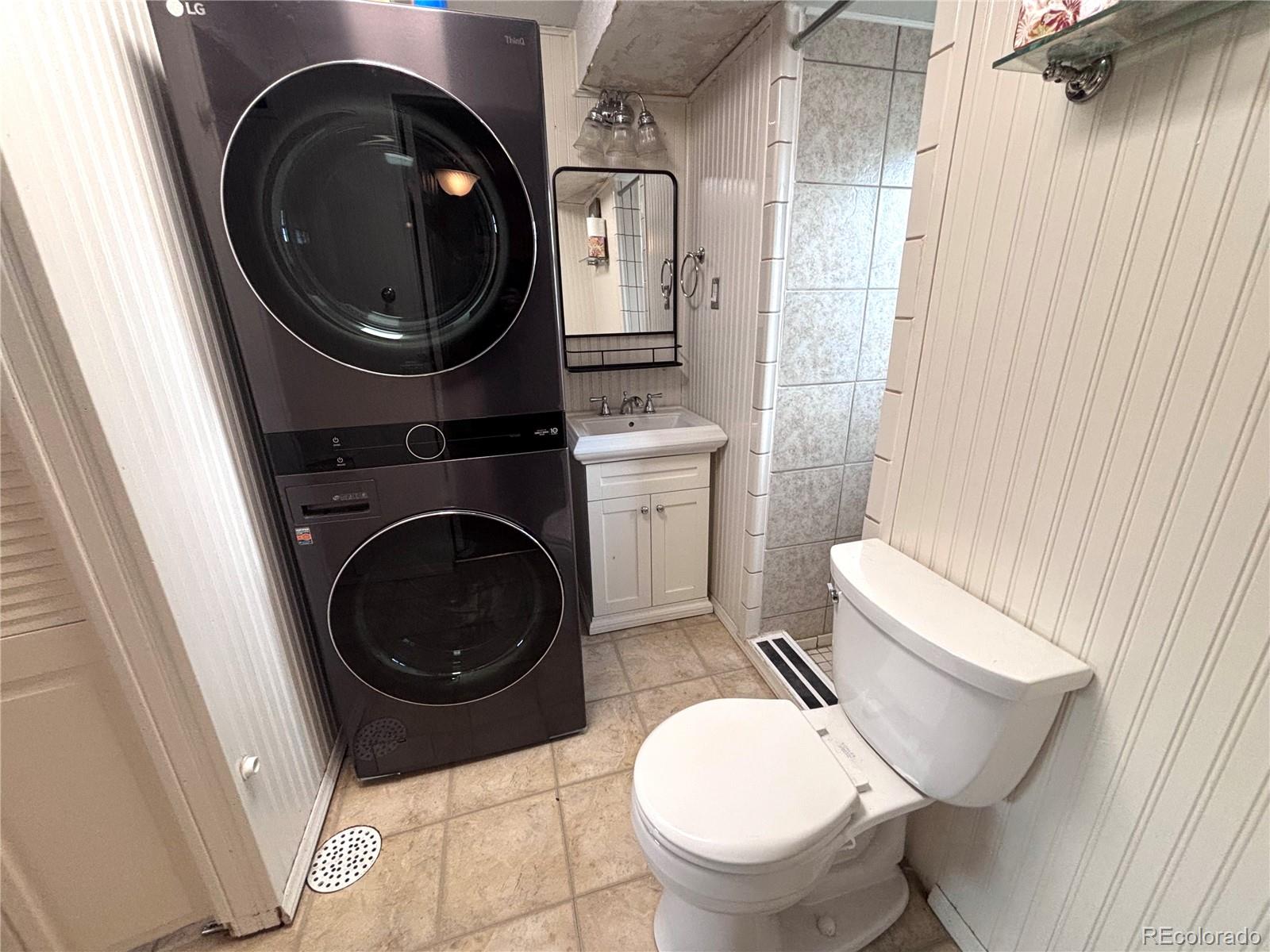 6910 Roaring Spring Terrace Fountain, CO 80817 - Photo 11 of 14 a bathroom with a toilet and a sink