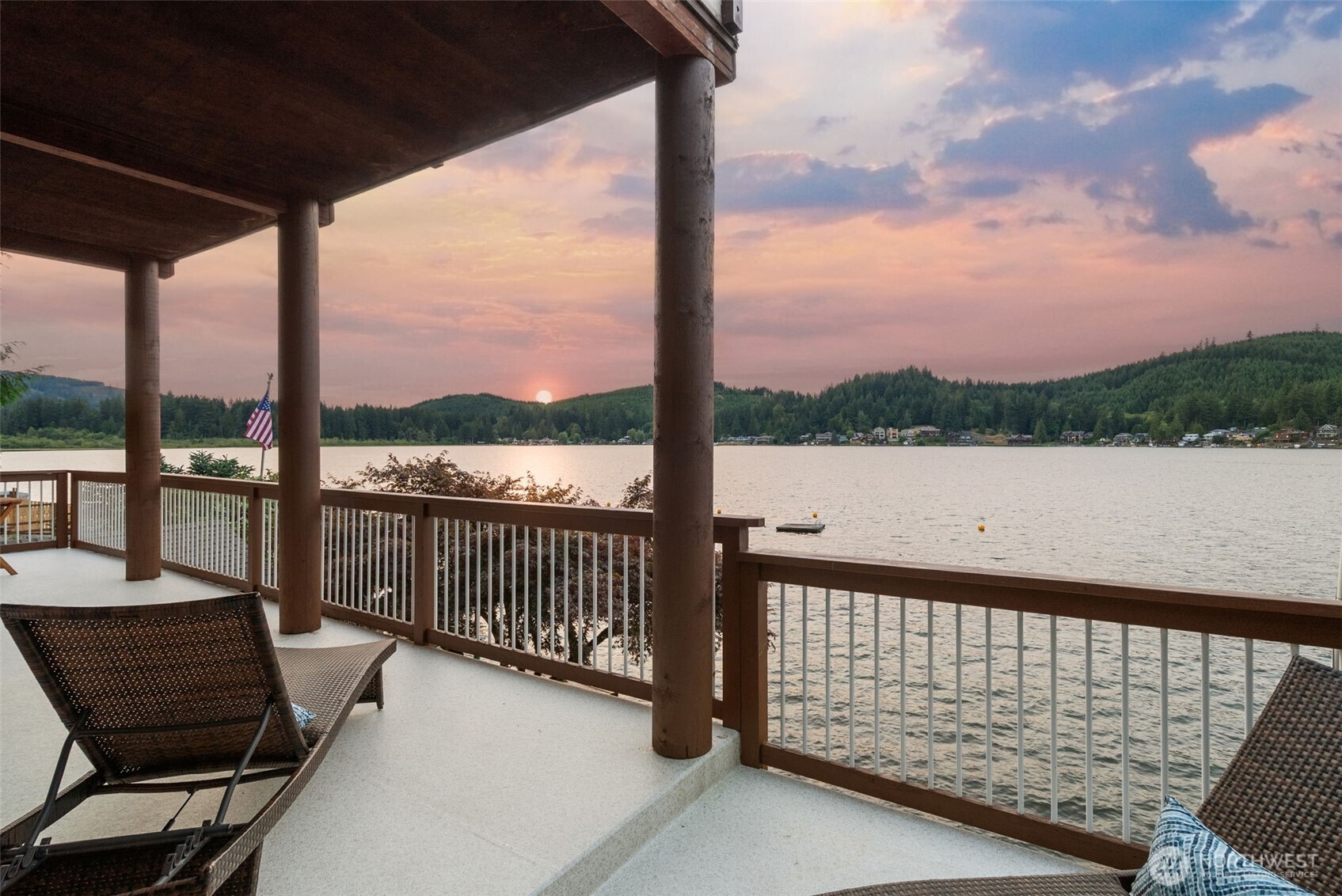 a view of a balcony with wooden floor