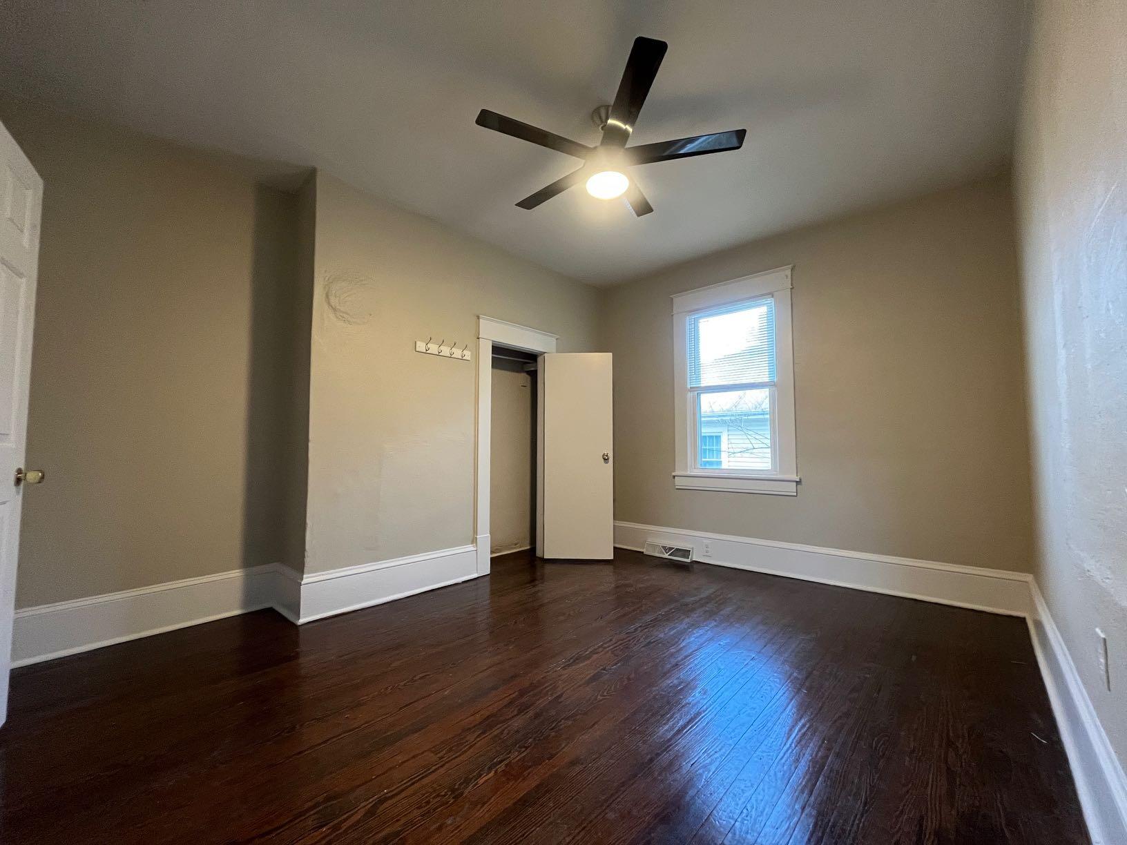 3641 Yellow Mountain Road Southeast Roanoke, VA 24014 - Photo 4 of 12 a view of an empty room with wooden floor and a window