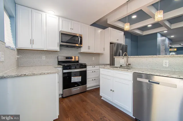 a white toilet sitting next to a bath tub