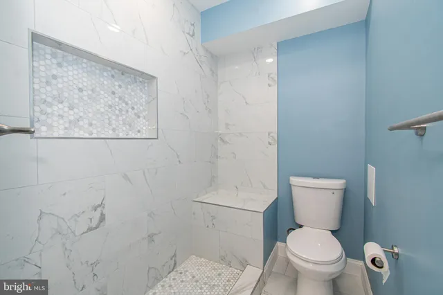 a view of balcony with wooden floor and trees in the background