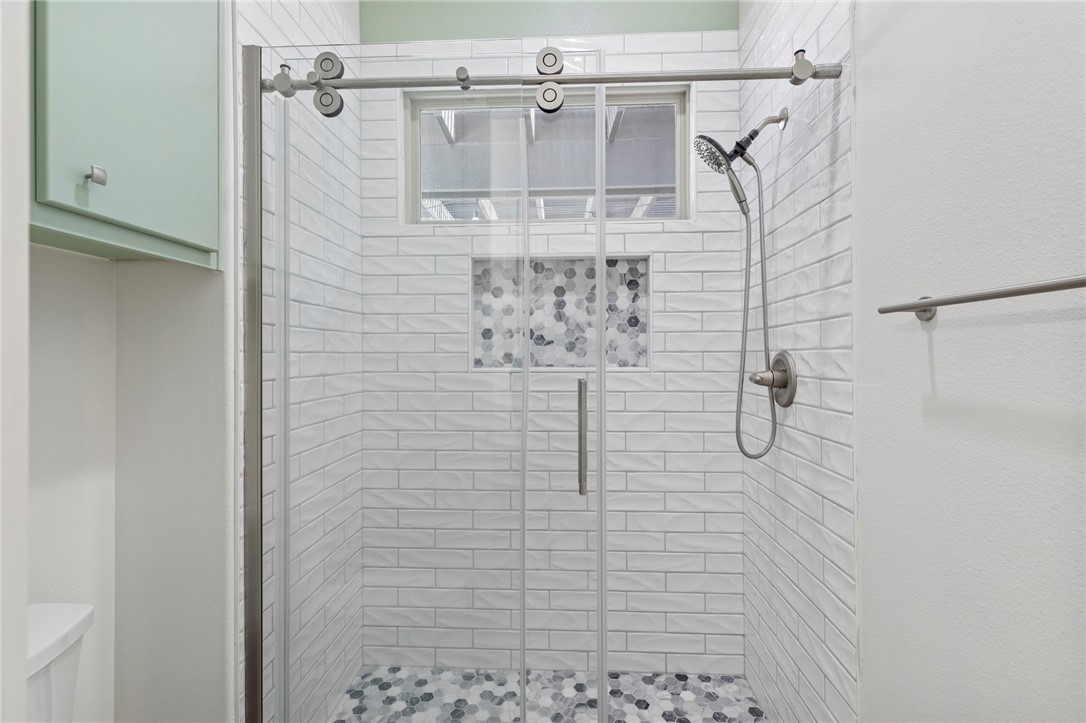 2833 Persimmon Ridge Court Bryan, TX 77807 - Photo 15 of 50 a bathroom with a shower