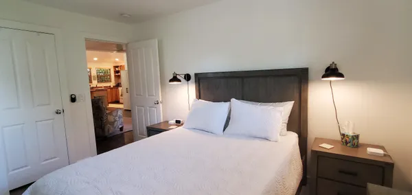 a bedroom with a bed and a table