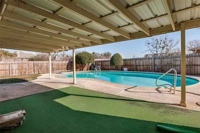 a view of a backyard of a house