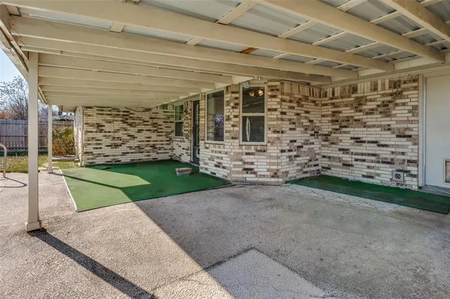 a view of a swimming pool with an outdoor seating