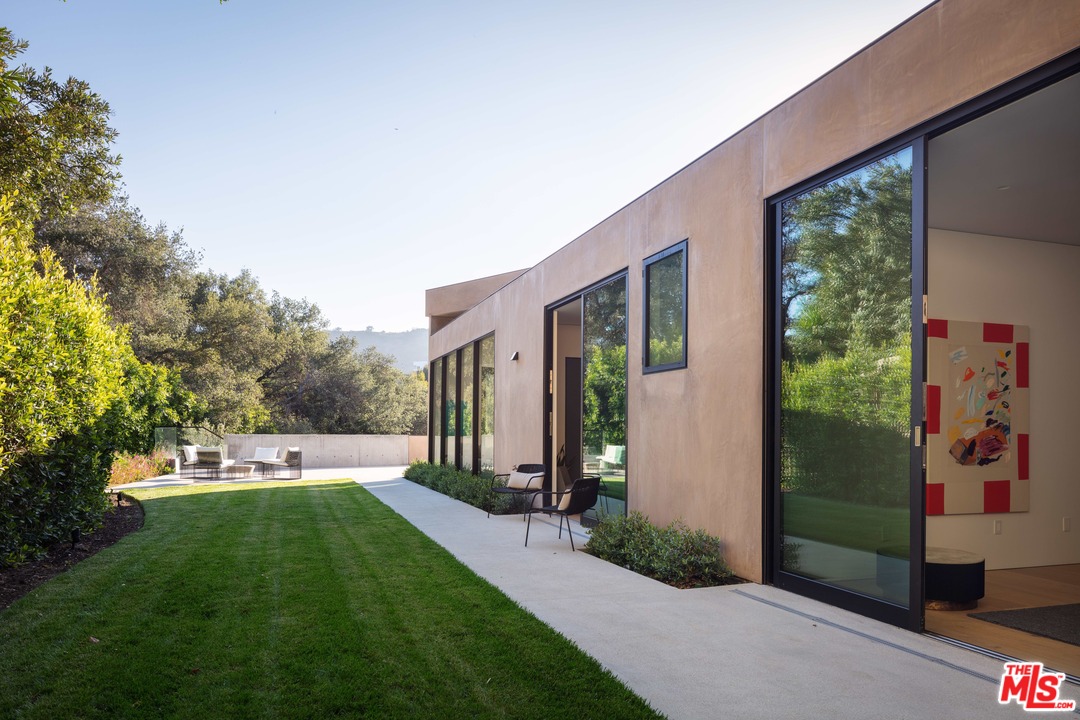 2600 Hutton Drive Beverly Hills, CA 90210 - Photo 15 of 29 a front view of a house with a yard