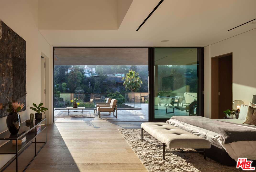 2600 Hutton Drive Beverly Hills, CA 90210 - Photo 17 of 29 a bed room with a bed and a large window