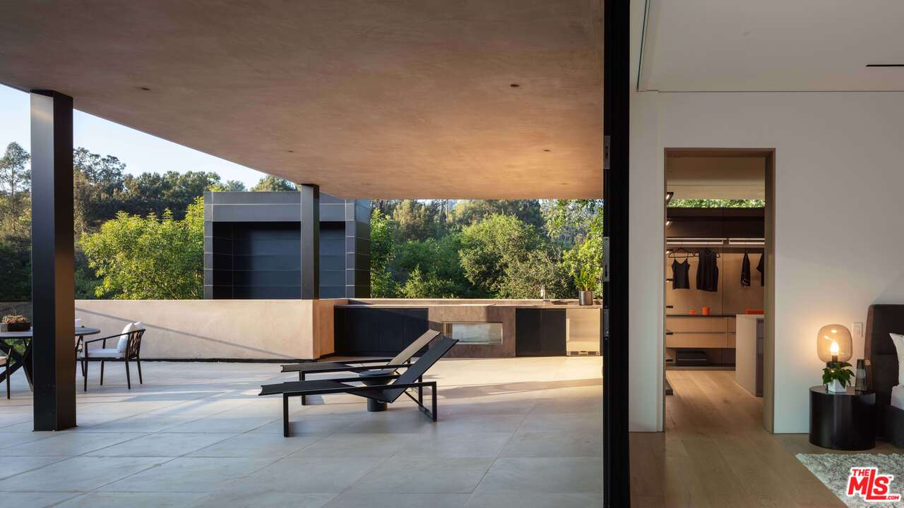 2600 Hutton Drive Beverly Hills, CA 90210 - Photo 18 of 29 a living room with furniture a rug potted plant and a large window