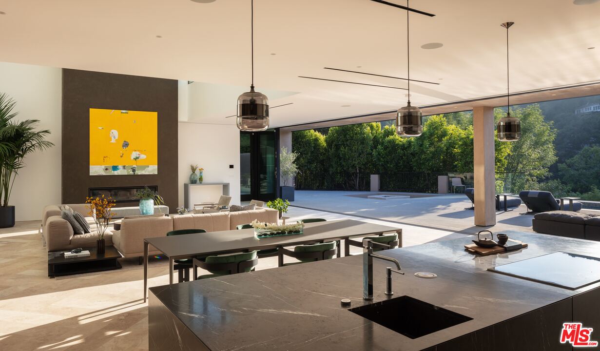 2600 Hutton Drive Beverly Hills, CA 90210 - Photo 5 of 29 a living room with furniture and floor to ceiling windows