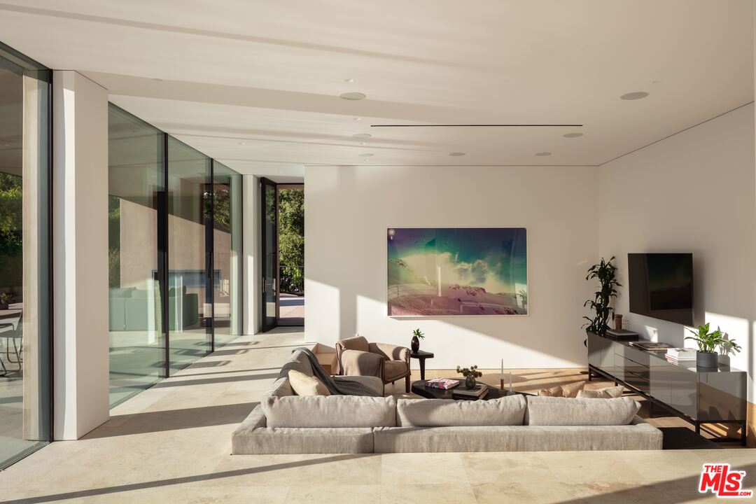 2600 Hutton Drive Beverly Hills, CA 90210 - Photo 6 of 29 a living room with furniture and a flat screen tv