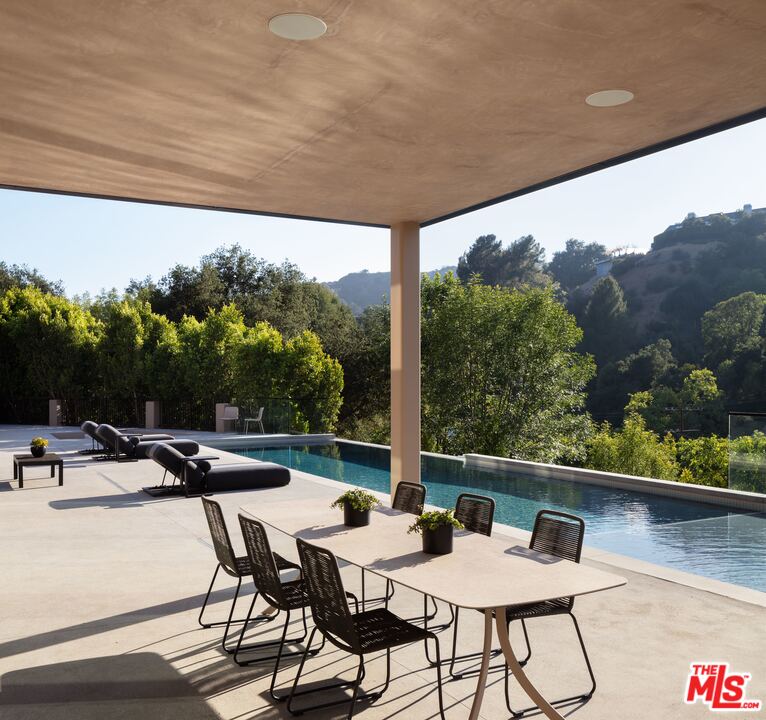 2600 Hutton Drive Beverly Hills, CA 90210 - Photo 10 of 29 a view of a patio with a table chairs and a backyard