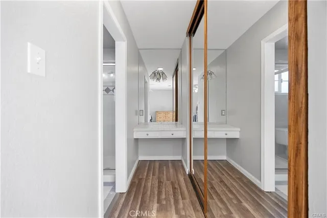 a view of a bathroom with a sink and mirror