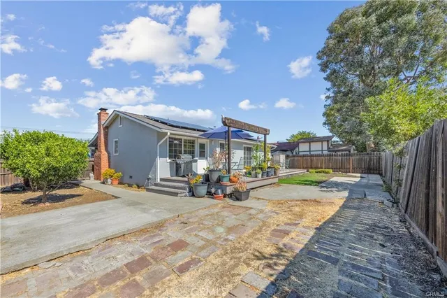 a view of a backyard with sitting area