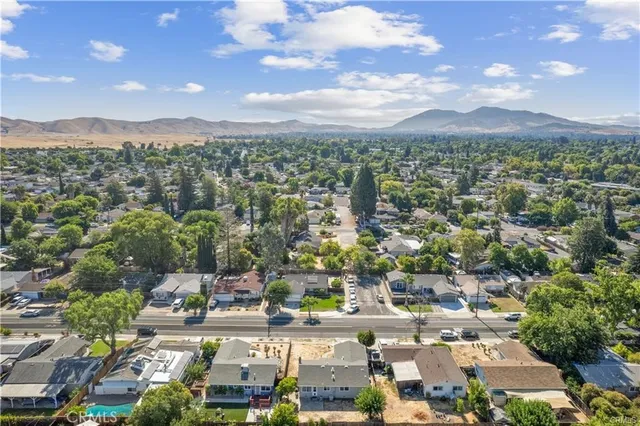 an aerial view of residential houses with outdoor space
