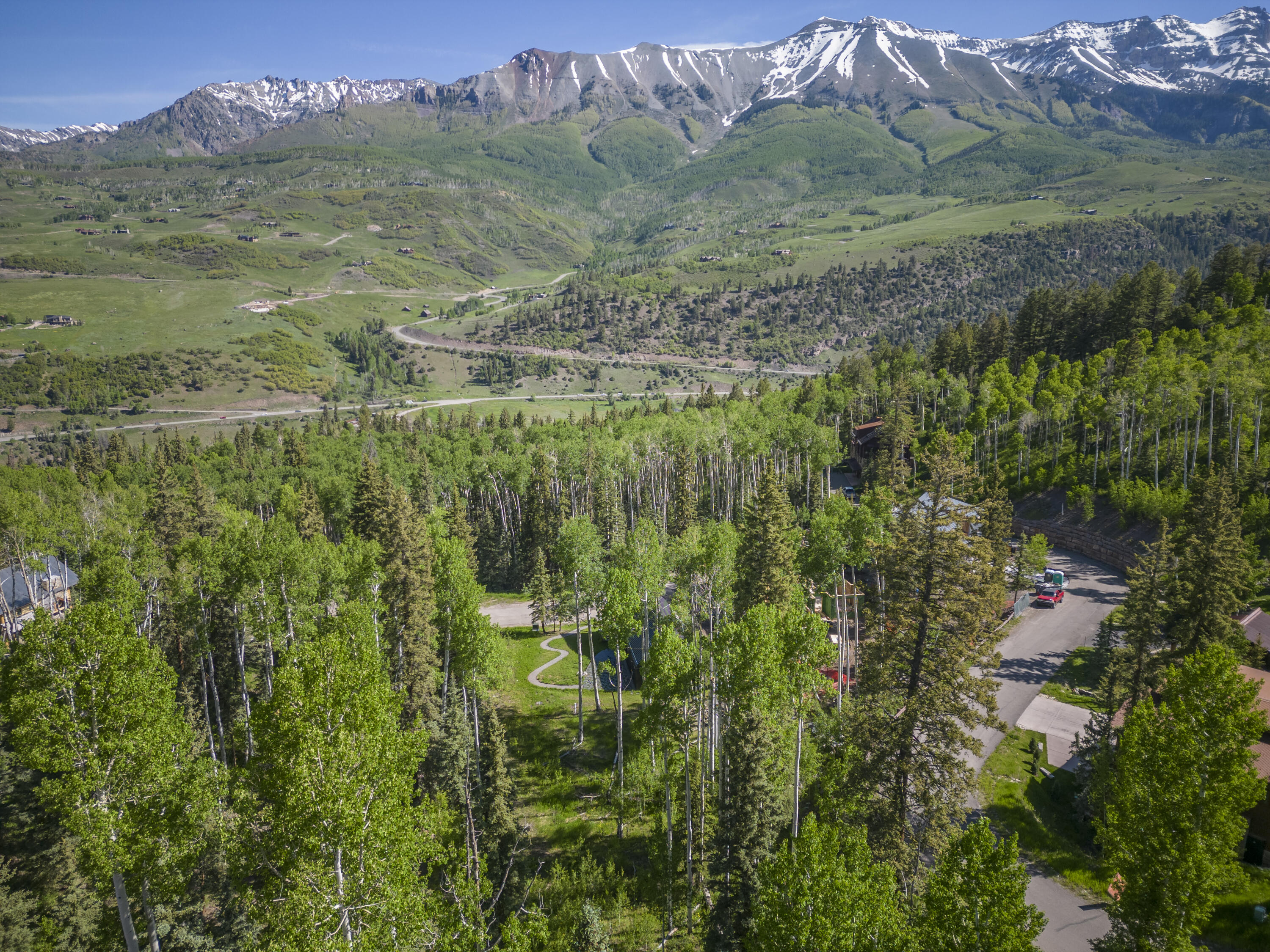 Tbd Adams Way Telluride, CO 81435 - Photo 6 of 14 a view of a lush green hillside and a houses
