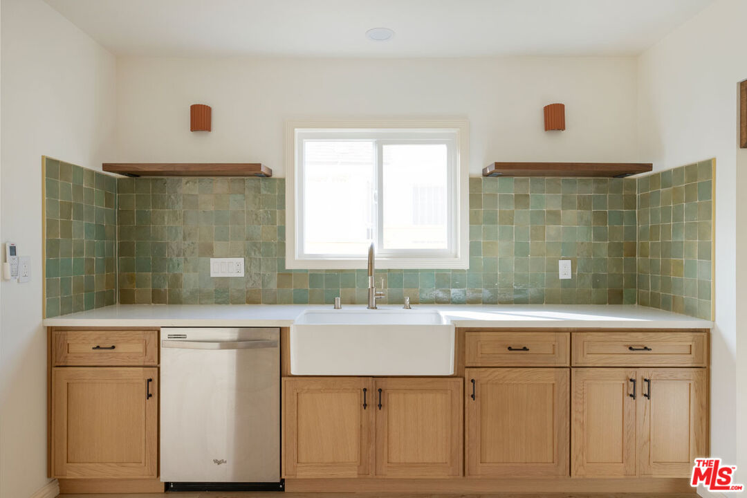347 North Rampart Boulevard Los Angeles, CA 90026 - Photo 9 of 24 a kitchen with a sink stove and cabinets