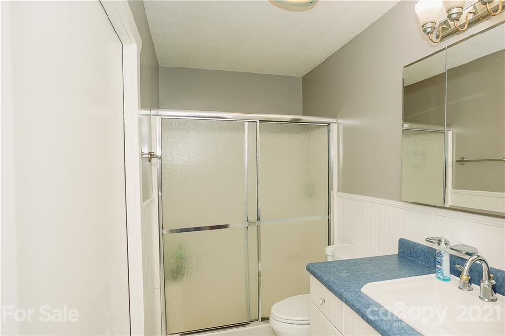 507 Vision Road Canton, NC 28716 - Photo 18 of 39 a bathroom with a sink a toilet and shower