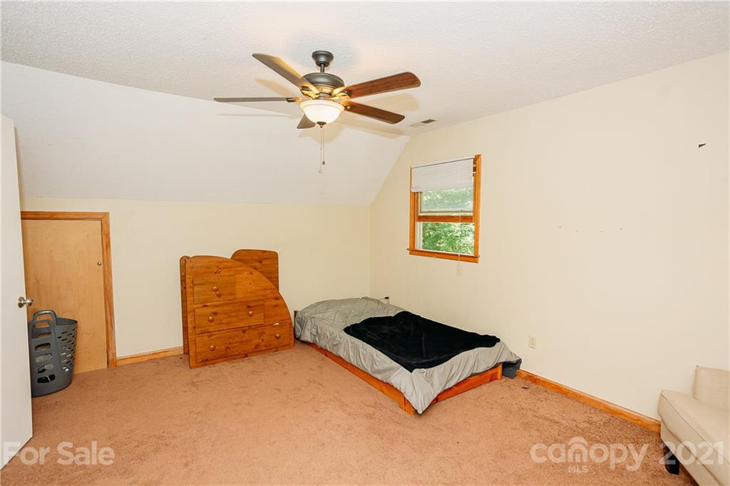 507 Vision Road Canton, NC 28716 - Photo 24 of 39 a view of a room with window and a ceiling fan