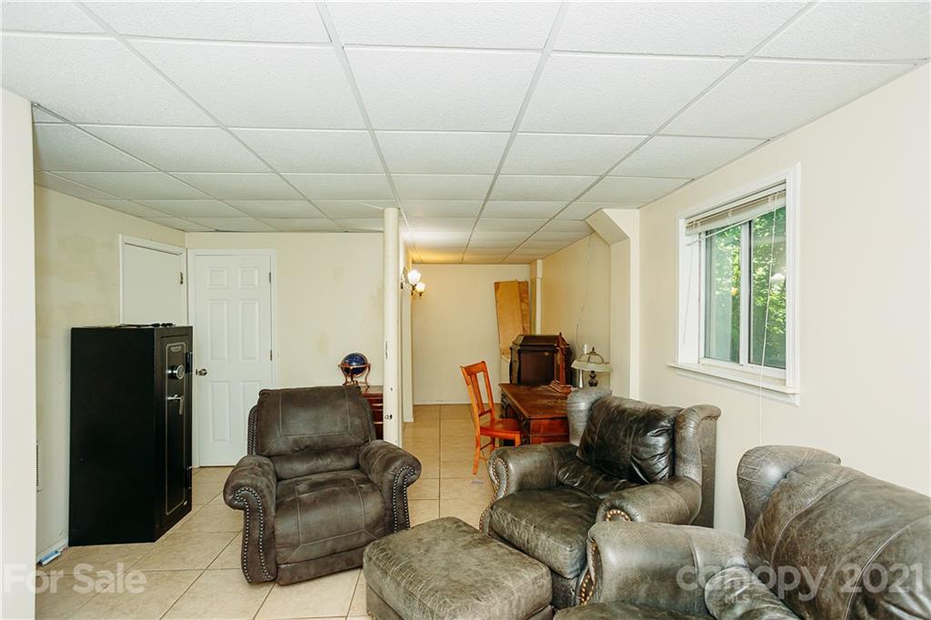 507 Vision Road Canton, NC 28716 - Photo 29 of 39 a living room with furniture and a window