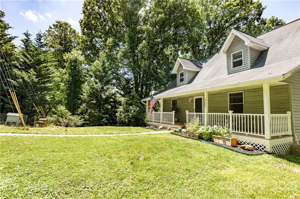 507 Vision Road Canton, NC 28716 - Photo 31 of 39 a front view of a house with a yard