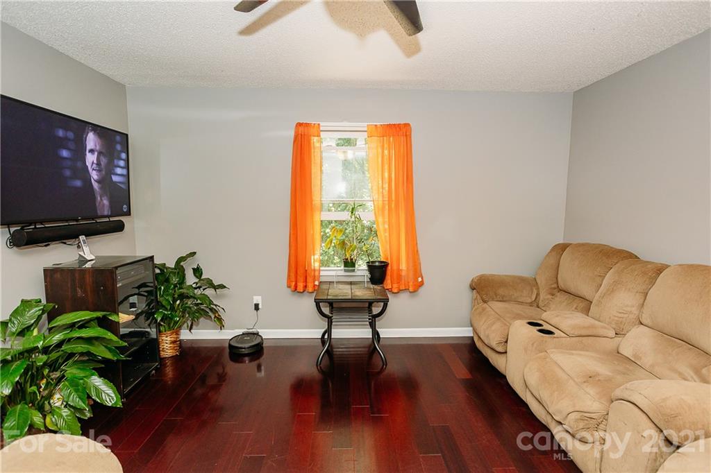 507 Vision Road Canton, NC 28716 - Photo 5 of 39 a living room with furniture and a flat screen tv