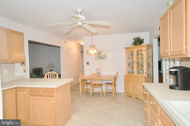 a very nice looking dining room with a large window