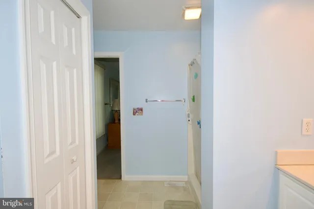 a white toilet sitting next to a bathroom sink