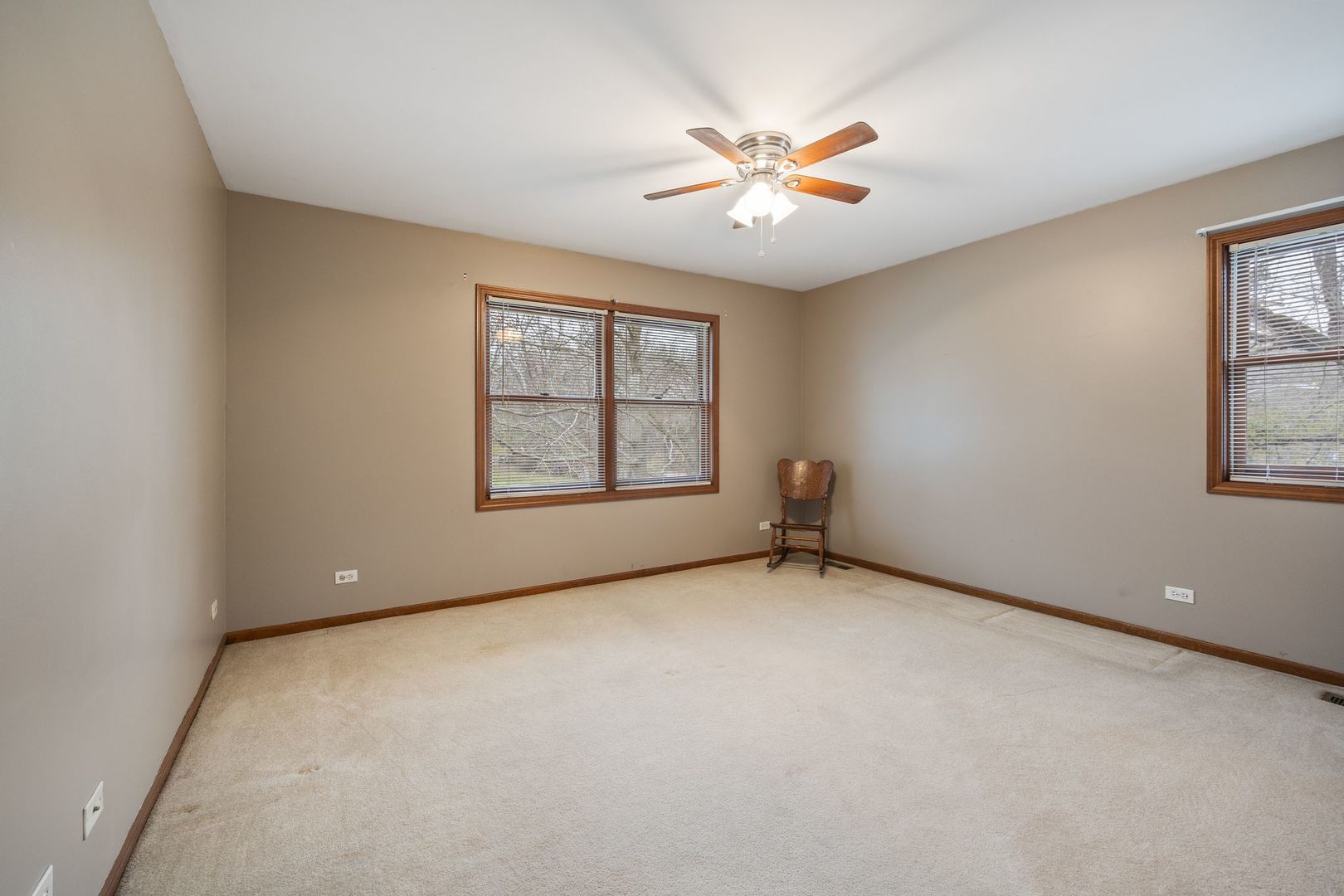 727 Old Hunt Road Fox River Grove, IL 60021 - Photo 11 of 26 an empty room with windows and ceiling fan